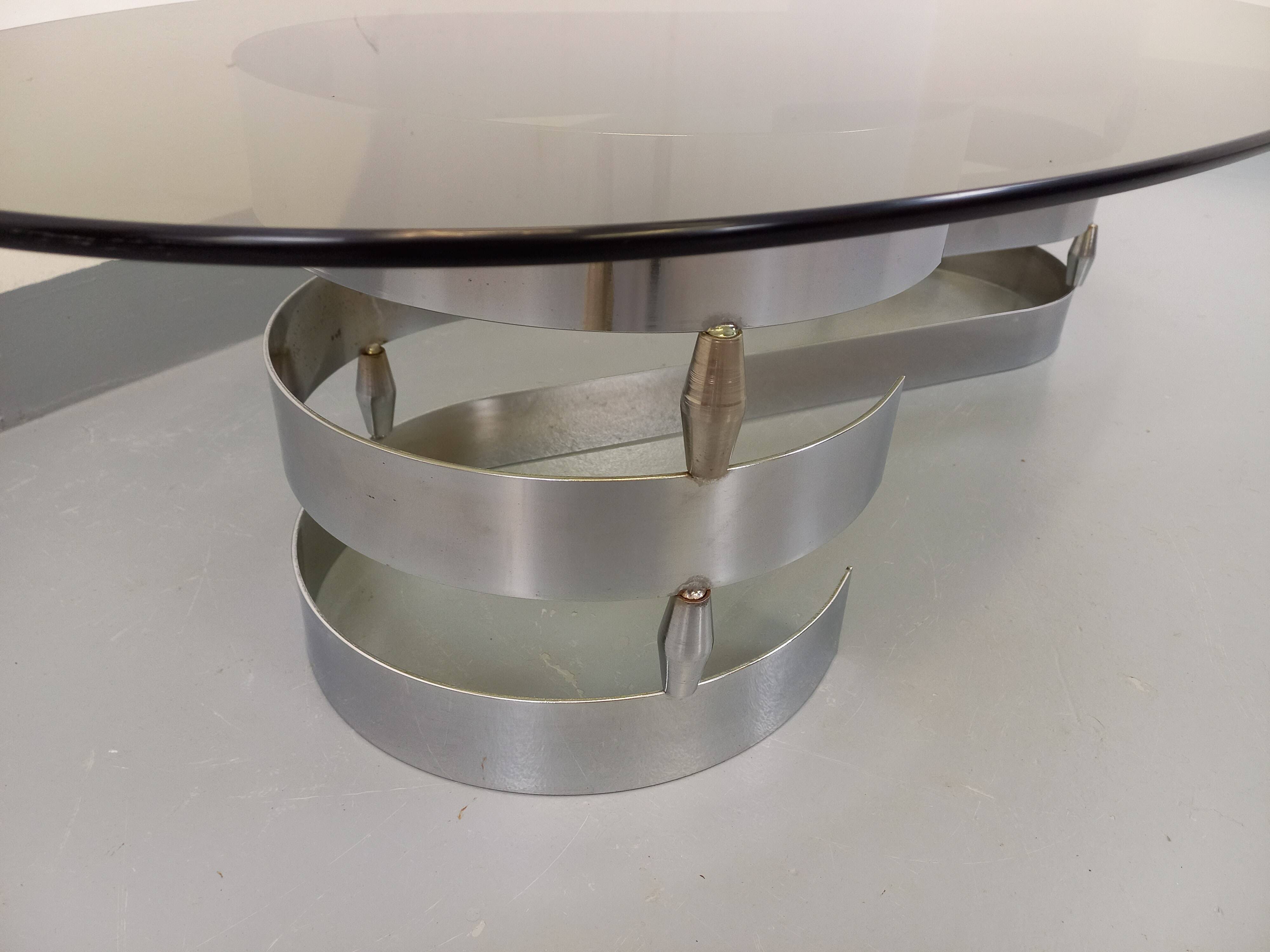 Vintage oval coffee table in smoked glass and chrome metal from the 1970s.