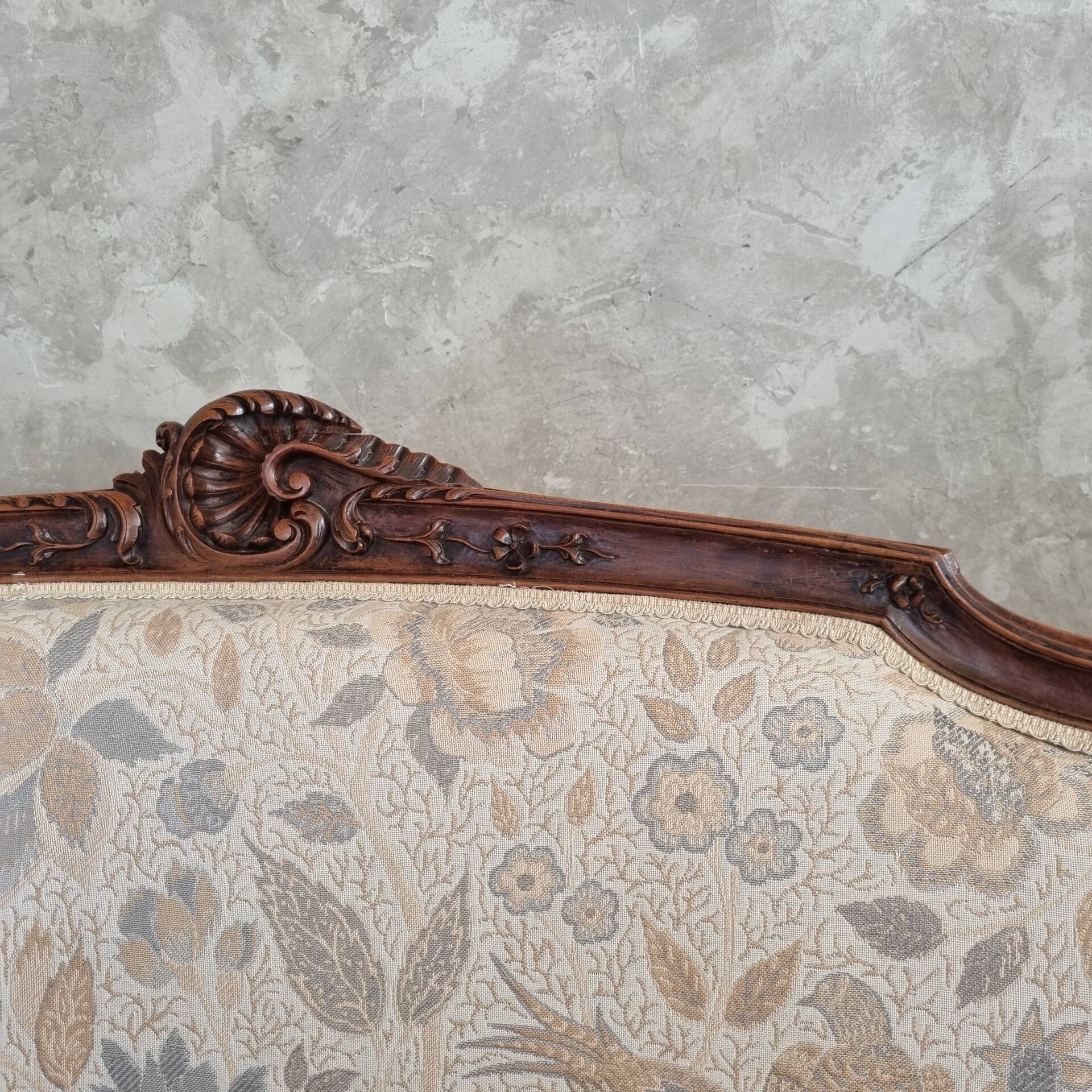 Small sofa or bench in Louis XV style, rococo.