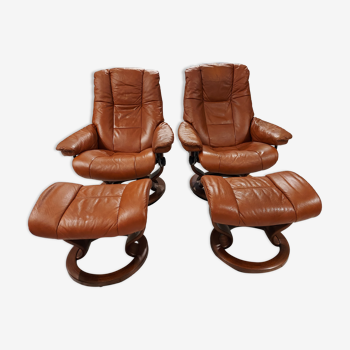 Pair of armchairs and footrests danish Ekornes vintage cognac leather 1970