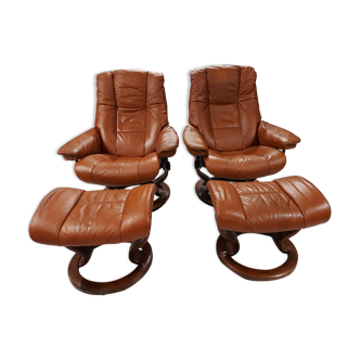 Pair of armchairs and footrests danish Ekornes vintage cognac leather 1970