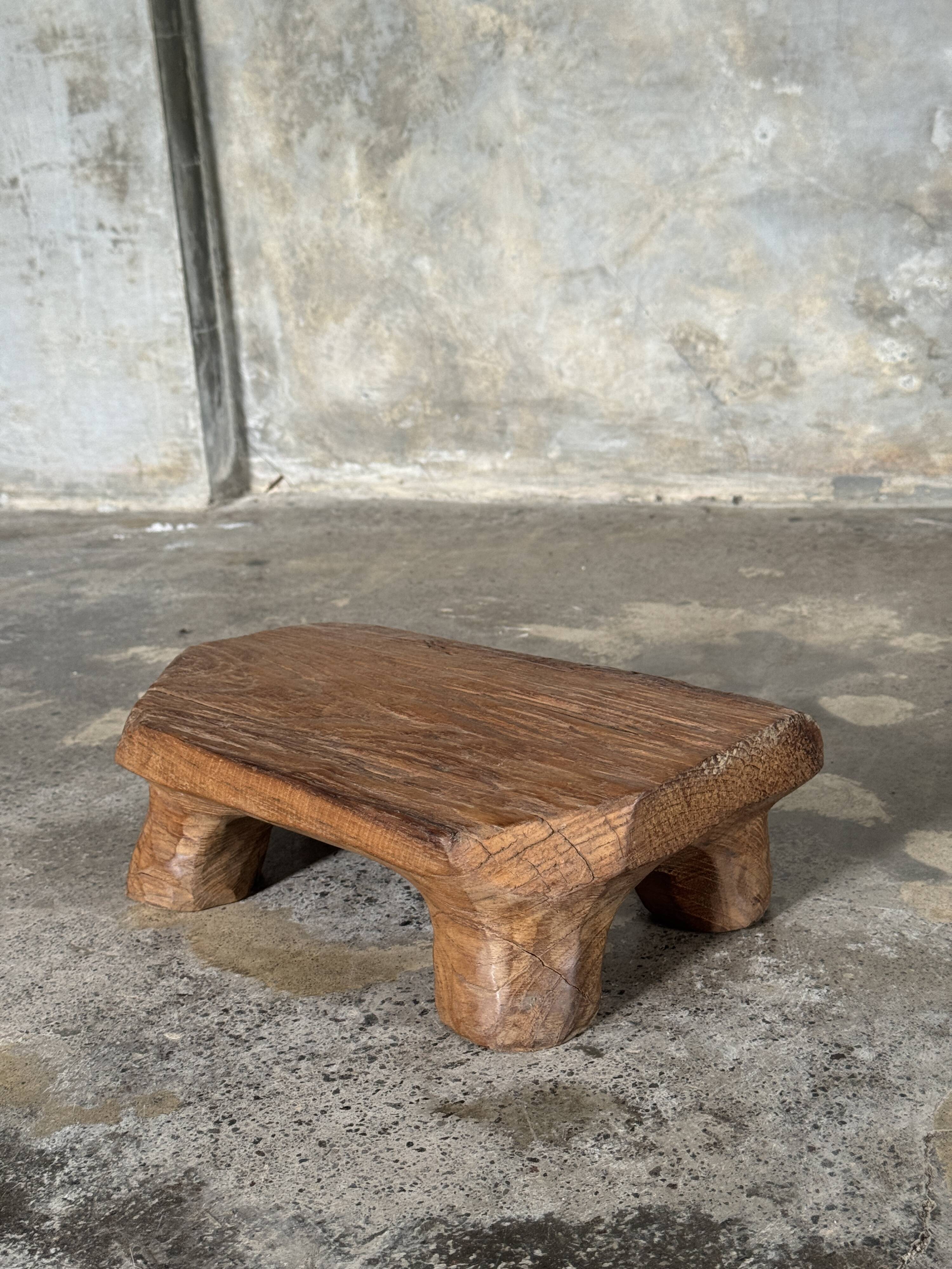 Small stool, teak footrest with short cut corners.