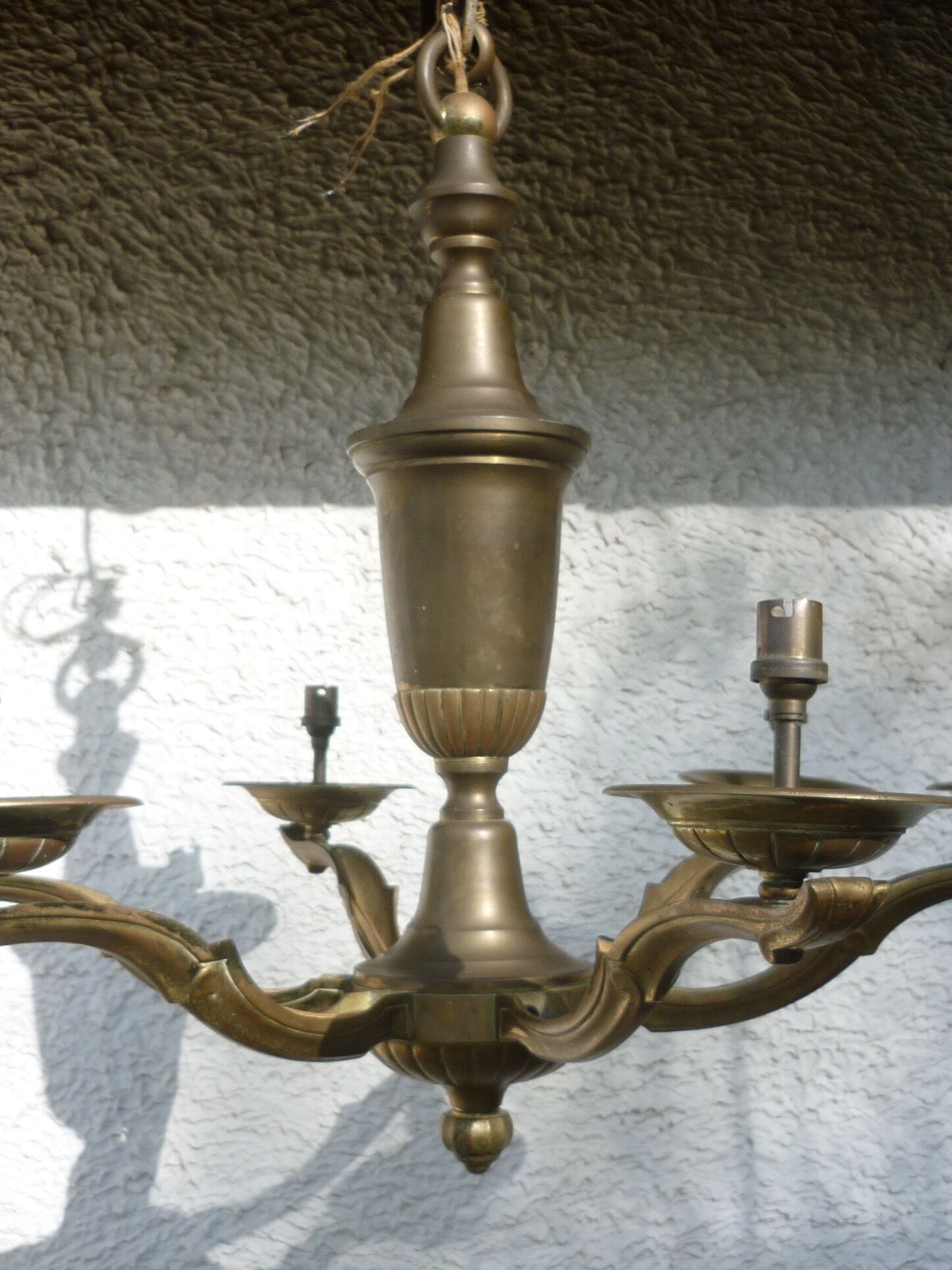 Large antique chandelier in copper and brass