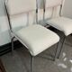 Pair of chrome chairs upholstered in boucle fabric.