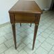 Extendable console table in cherry wood.