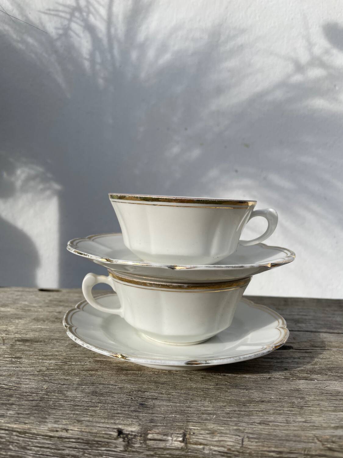 Pair of fine white and gold Limoges porcelain teacups