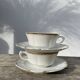Pair of fine white and gold Limoges porcelain teacups