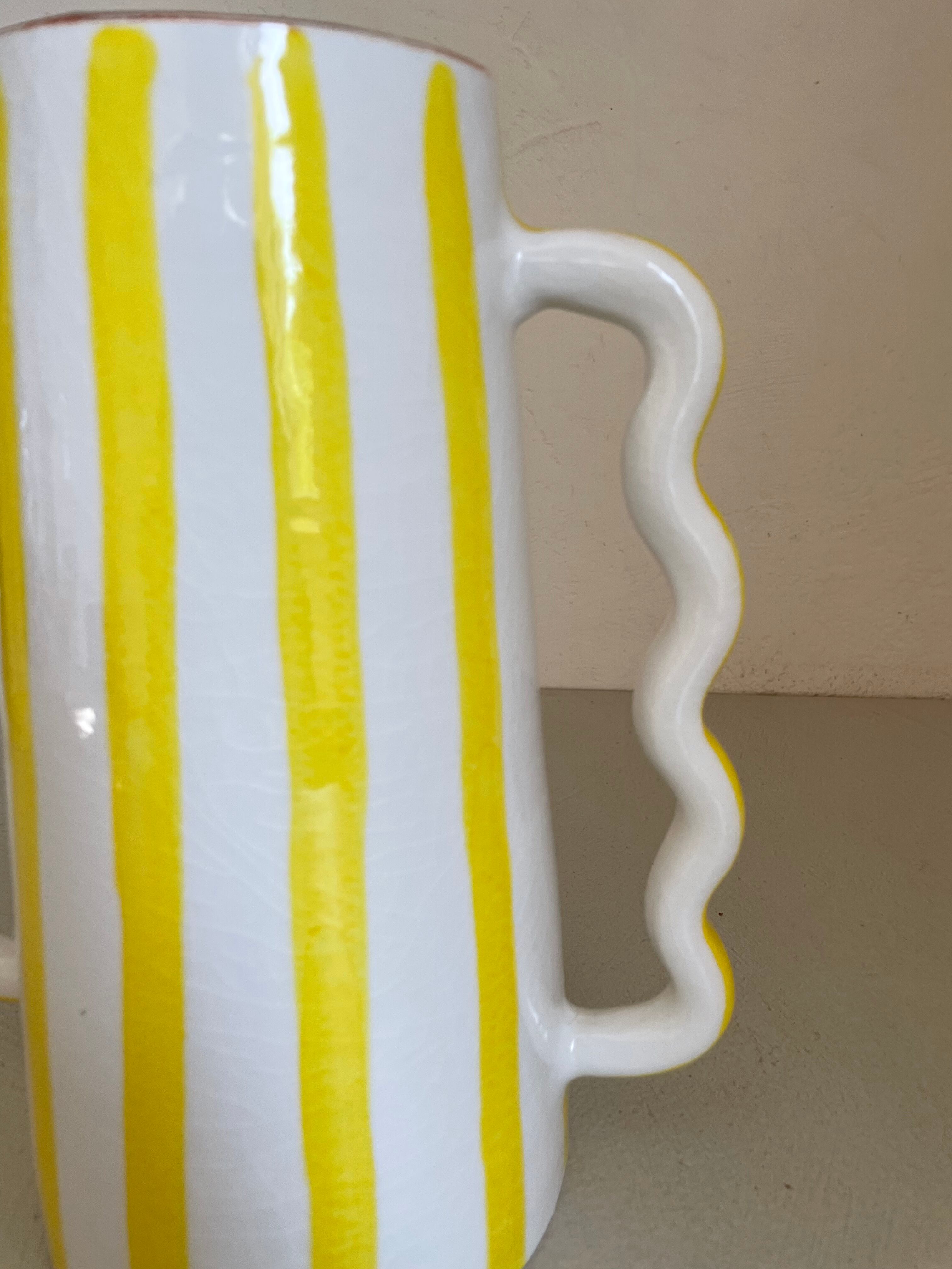 Lemon yellow and white striped ceramic vase with abstract wavy handmade handheld