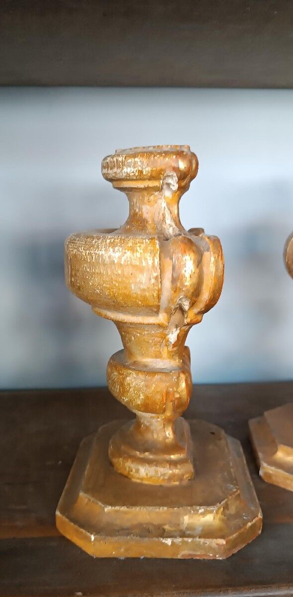 An antique pair of Louis XIV style paddle holders.