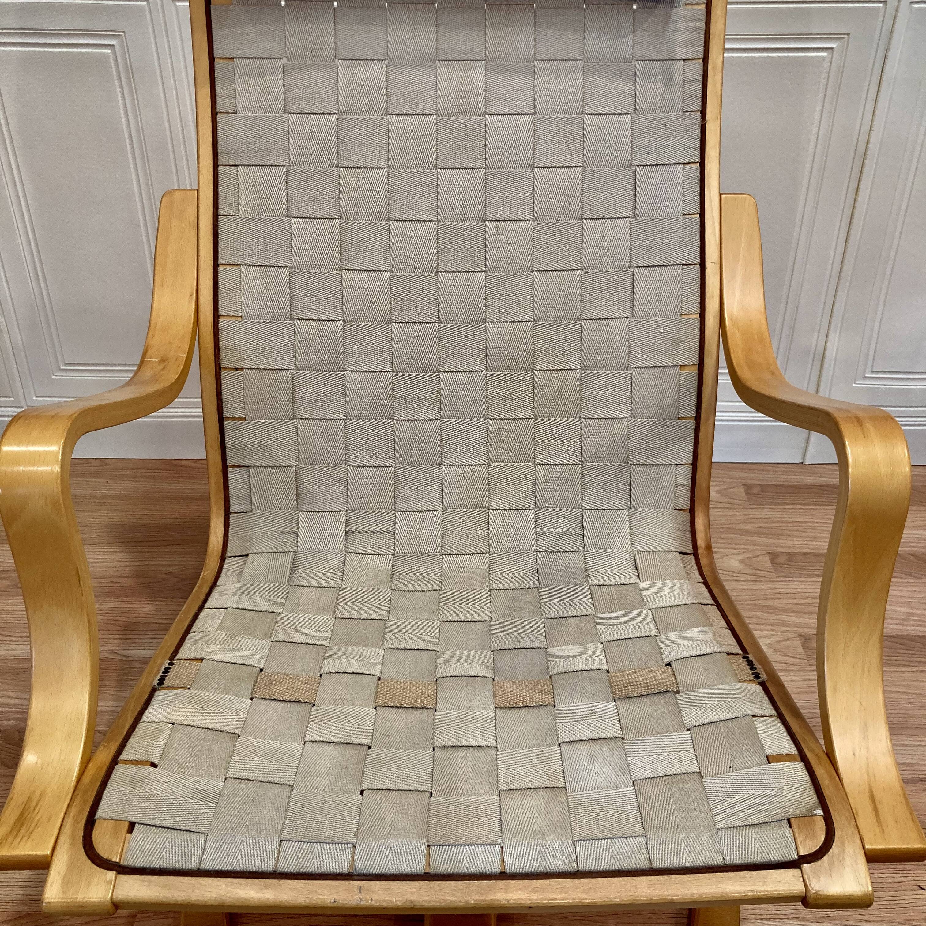 Swivel armchair and its ottoman in 1960s Scandinavian design.