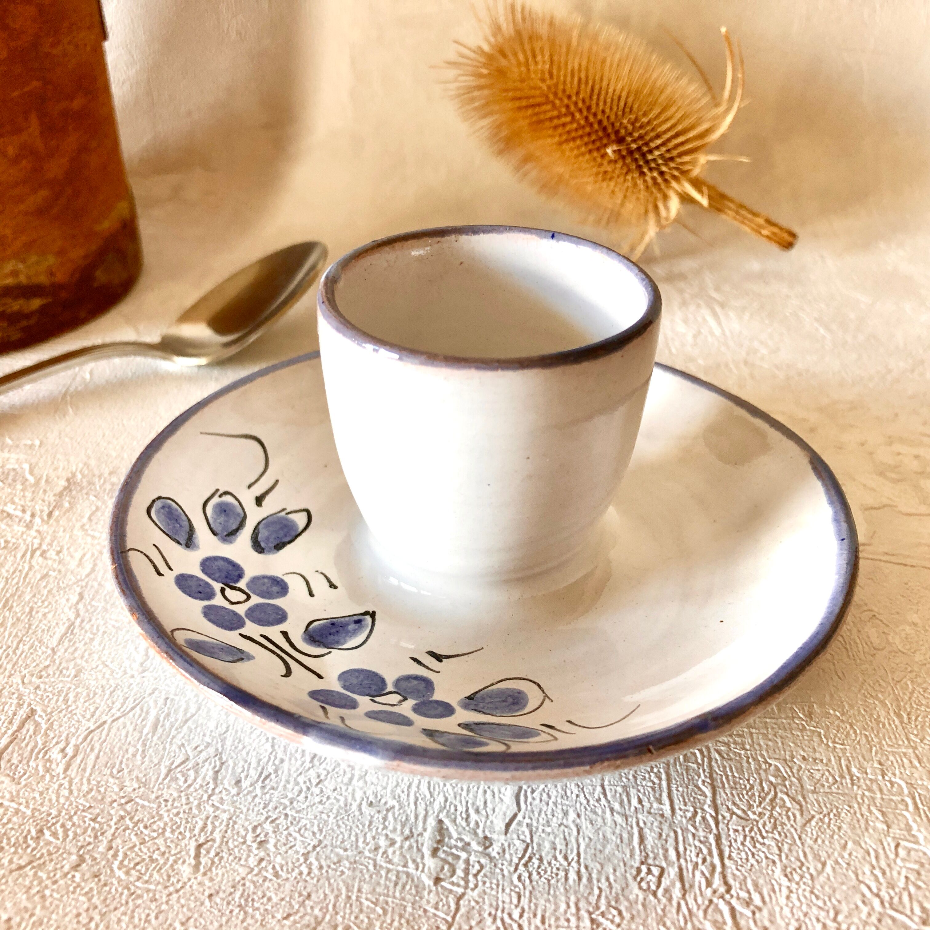 Glazed ceramic shell with painted floral decoration