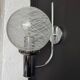 Chrome wall light with blown glass from the 1970s.