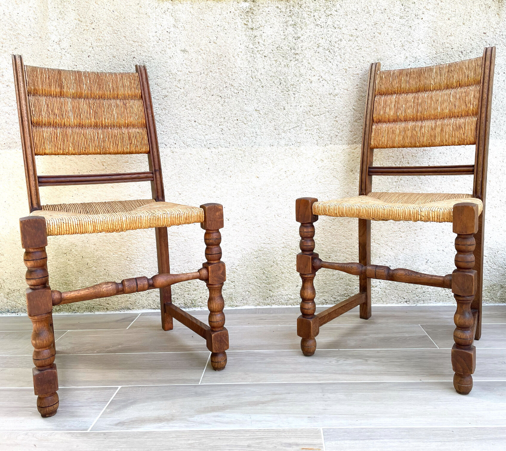 Pair of straw and solid oak chairs