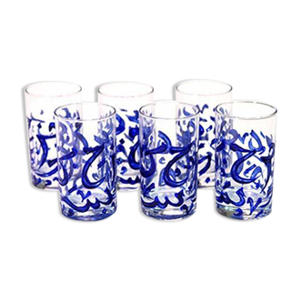 6 handcrafted glasses decorated with blue Arabic calligraphy.