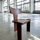 Retro brutalist chair in dark solid wood