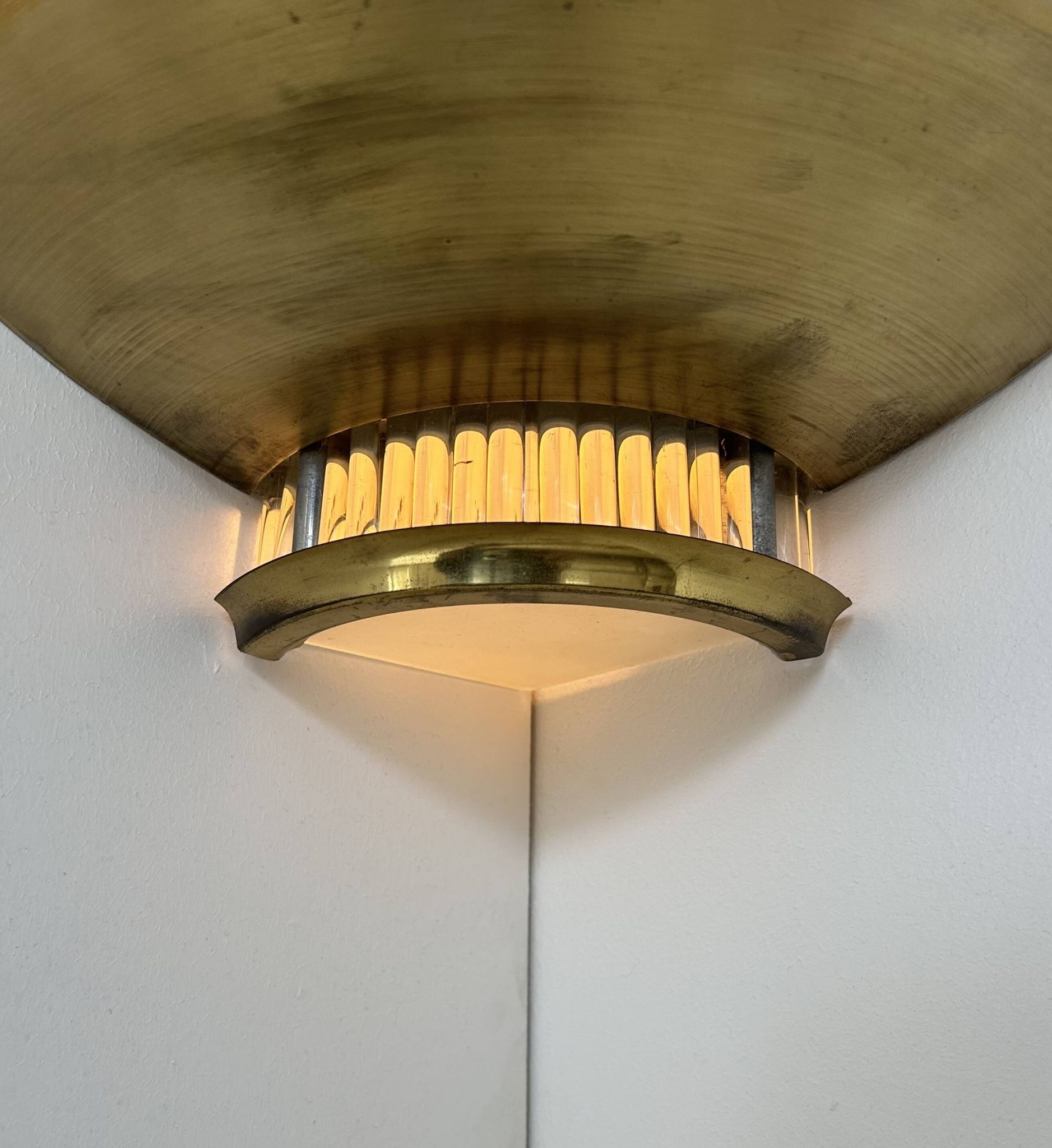 Pair of Art Deco corner sconces, brass and glass, France 1930