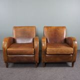 Paire de fauteuils en cuir de mouton