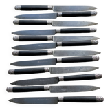 Set of 12 19th century table knives with ebony and chiseled silver handles