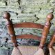 Set of 4 solid wood chairs with straw seats.