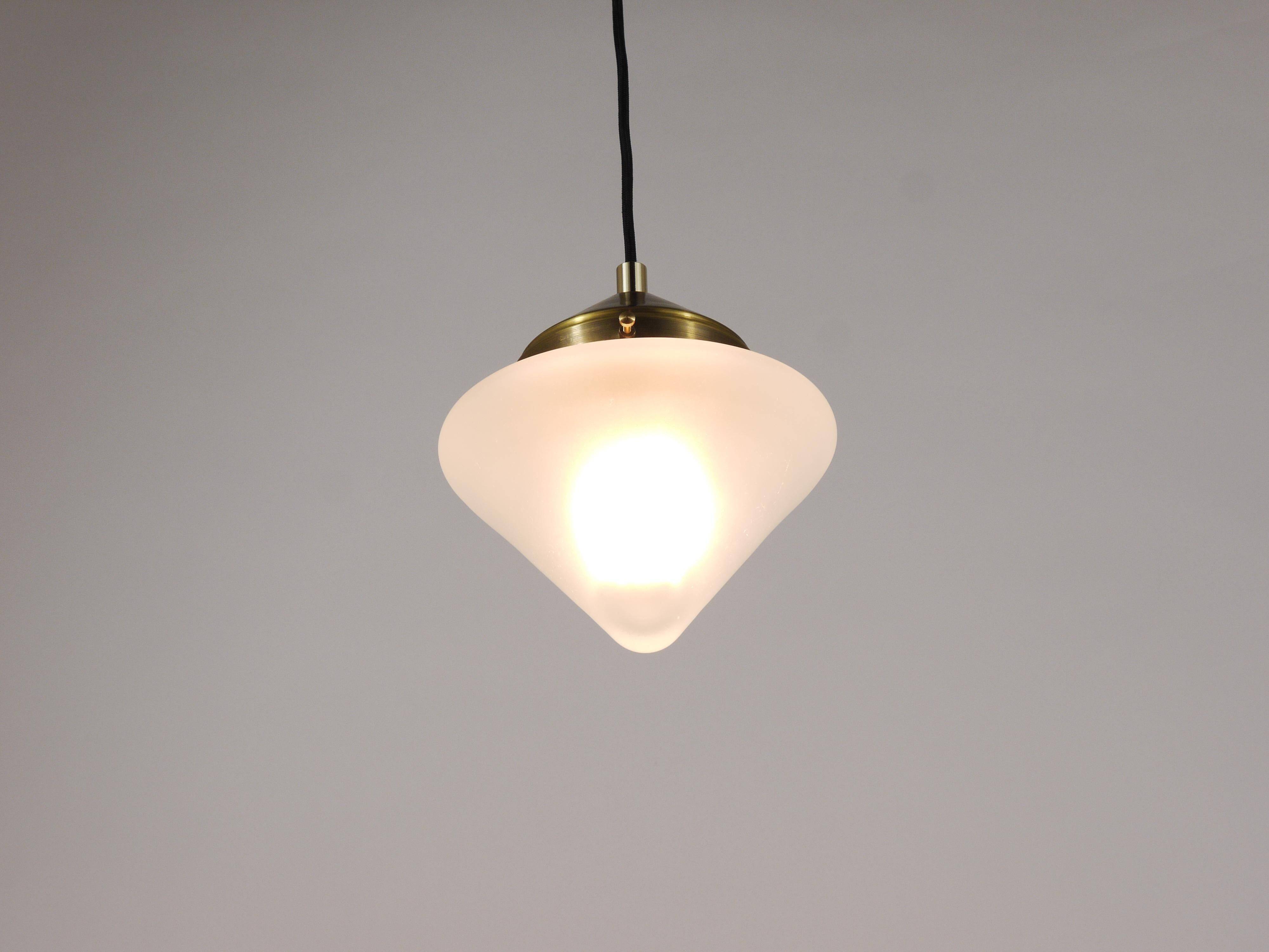 Up to 7 Art Deco brass pendant lights with conical glass shades, Vienna 1930s.