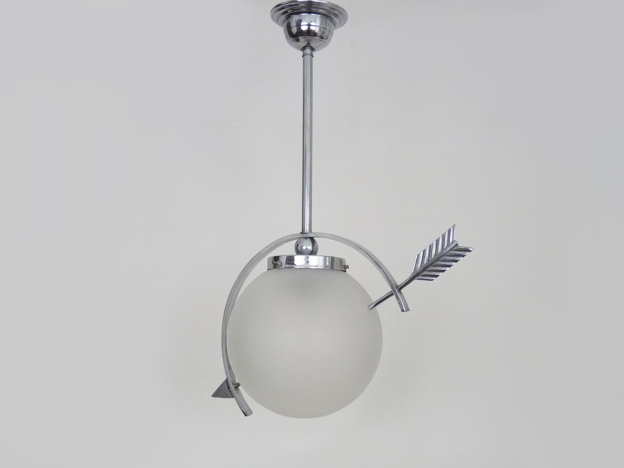 Suspension in chromed metal and glass, space age, arrow crossing a globe. Seventies