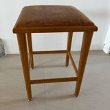 Vintage stool from the 60s with aged leather seat