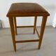 Vintage stool from the 60s with aged leather seat