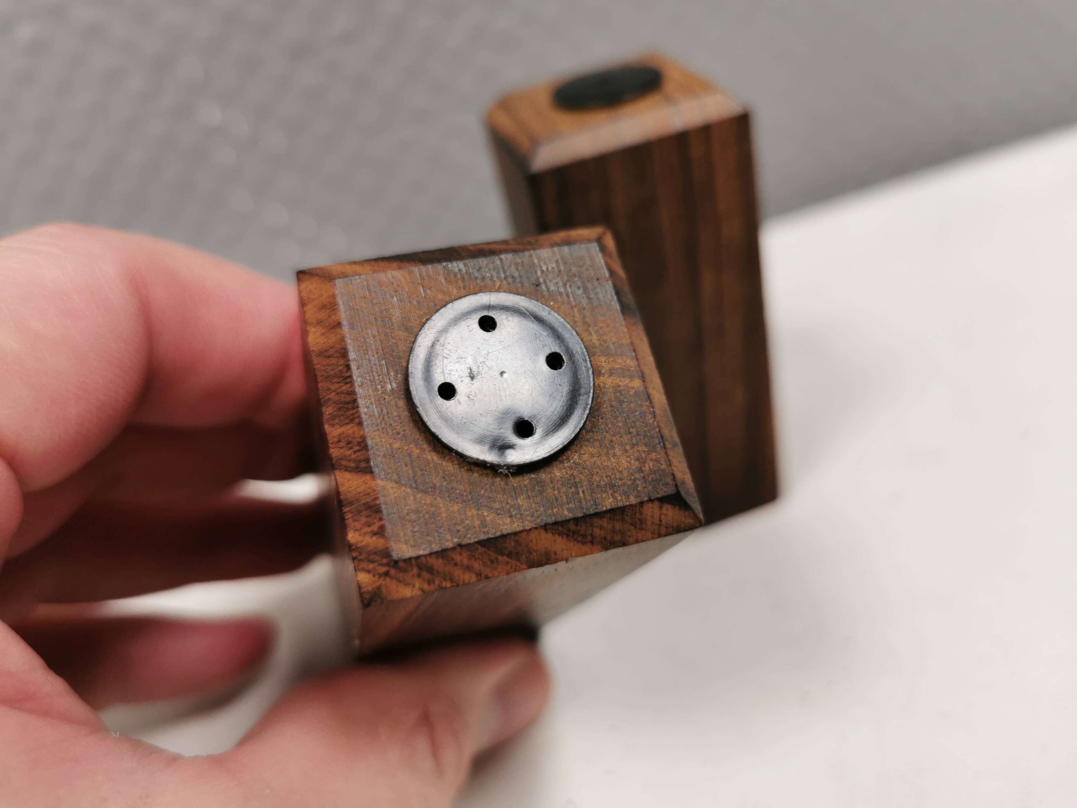 A set of salt and pepper shakers in rosewood
