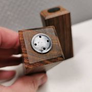 A set of salt and pepper shakers in rosewood