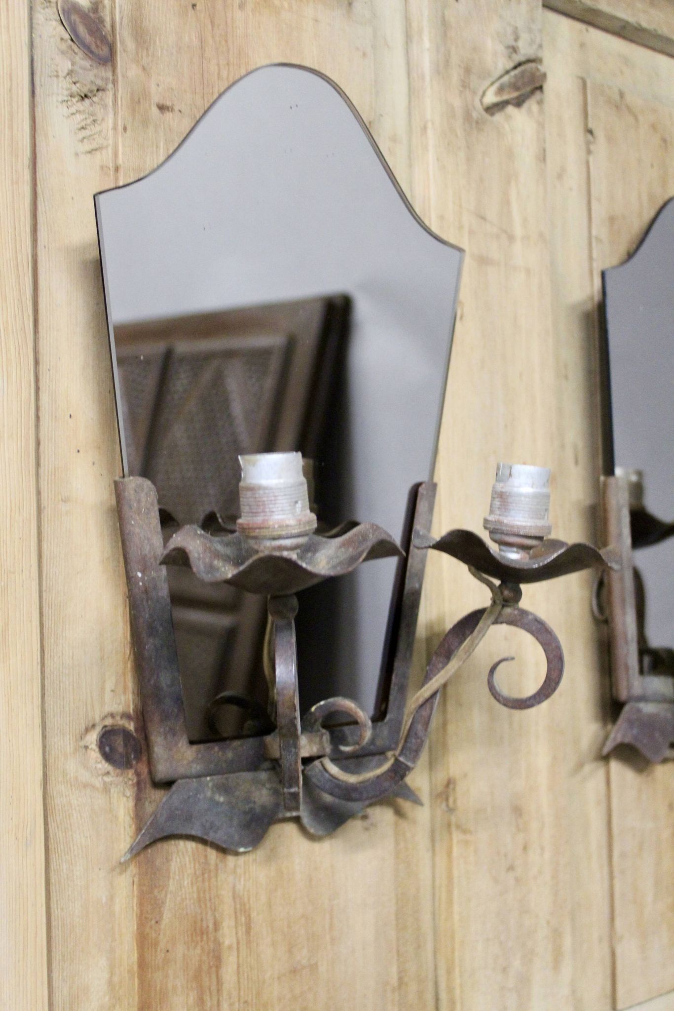 Pair of Art Deco wrought iron and smoked glass wall lights