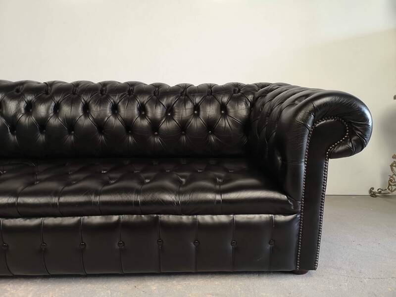 Black leather chesterfield sofa