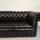 Black leather chesterfield sofa