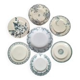 Old mismatched flat plates in iron earth earthenware accompanied by a dish