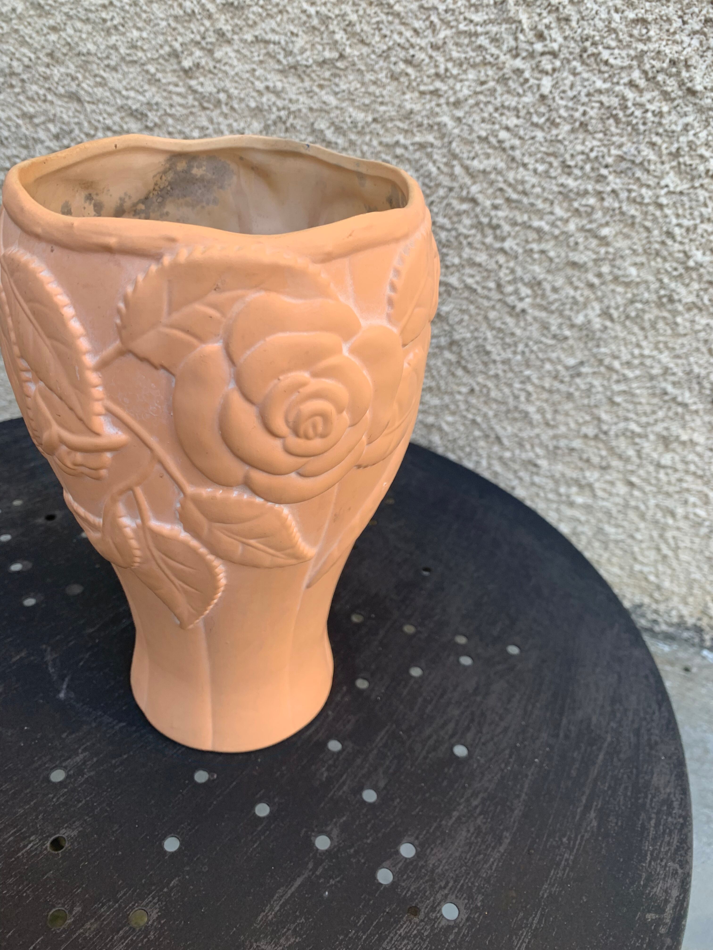 Terracotta vase with a vintage ceramic relief rose pattern
