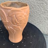 Terracotta vase with a vintage ceramic relief rose pattern