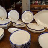 Limoges porcelain table service with blue band on white and gold background