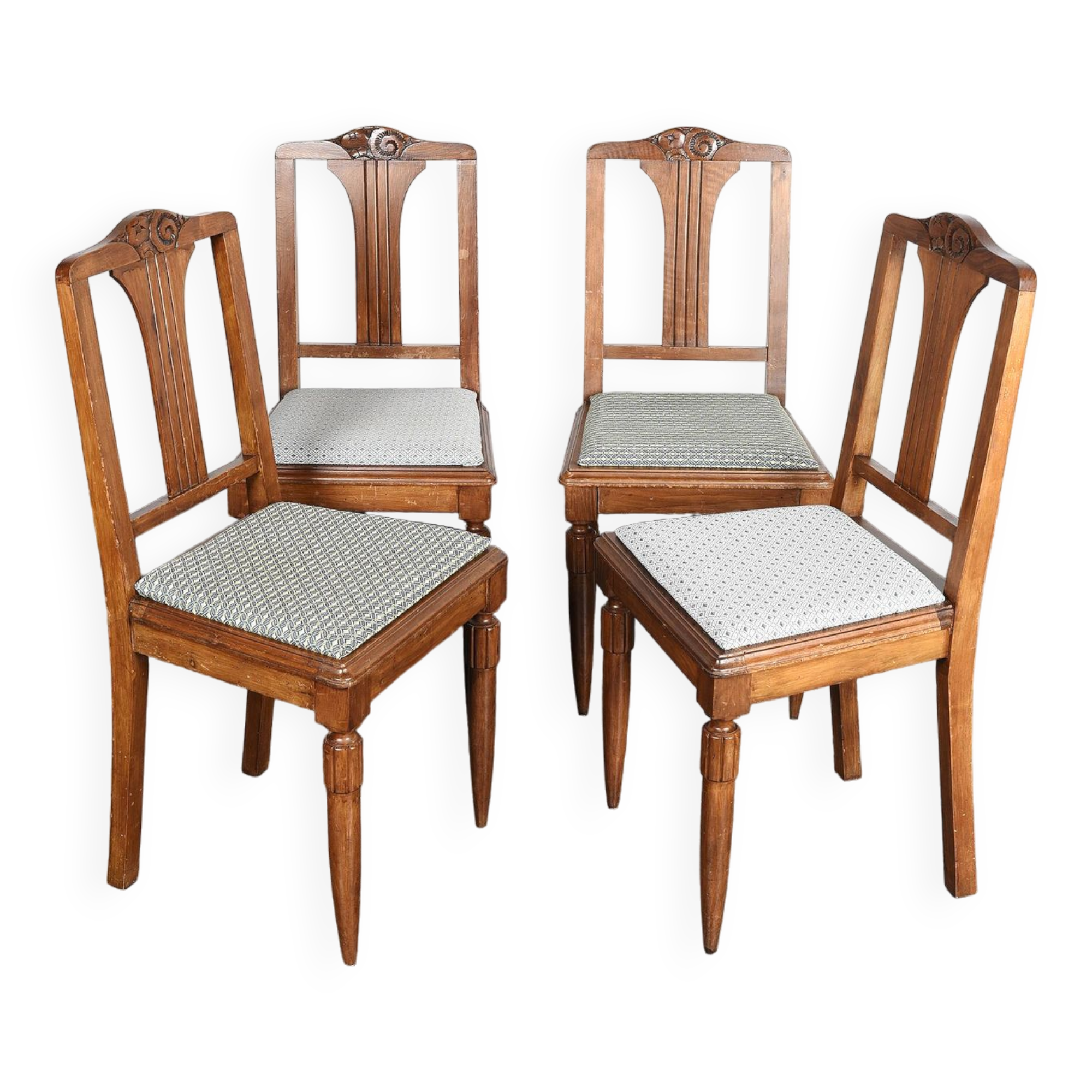 Set of 4 Art Deco chairs in carved wood.