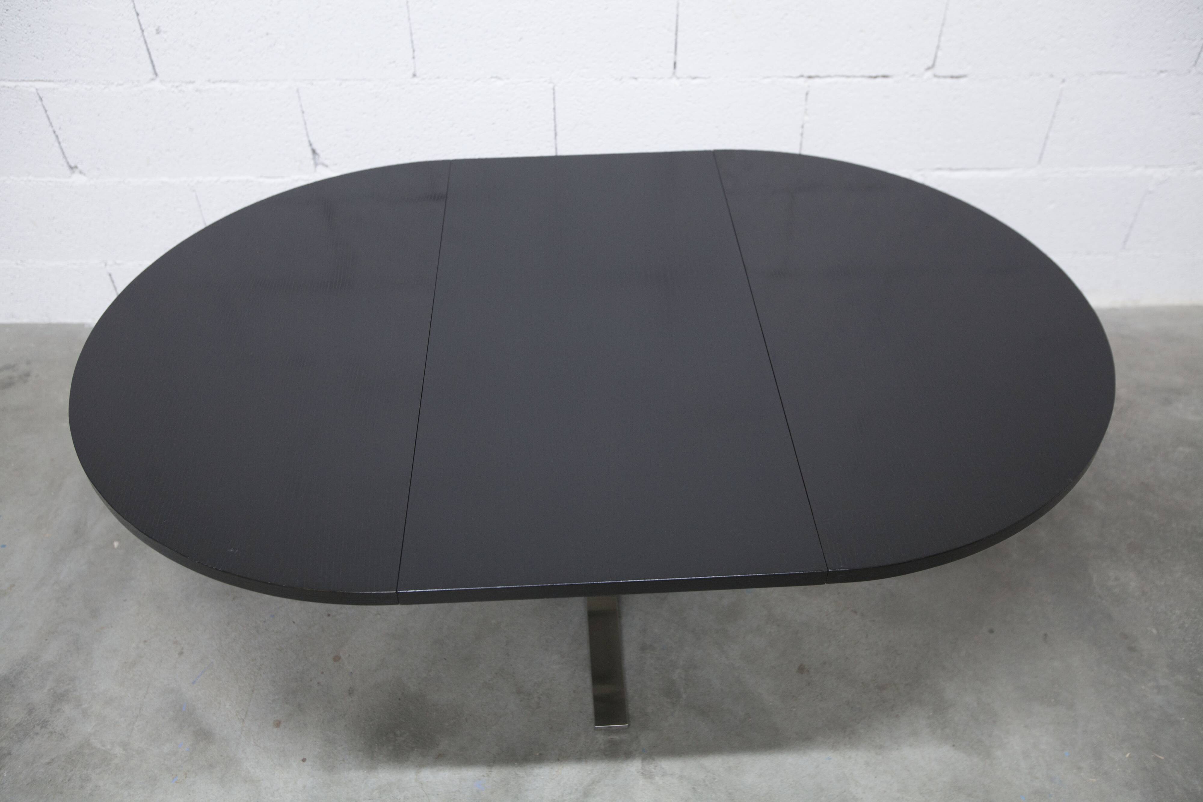Round table rises and lowers Osvaldo Borsani black and chrome with extension