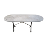 Old bistro table in marble and godin cast iron foot