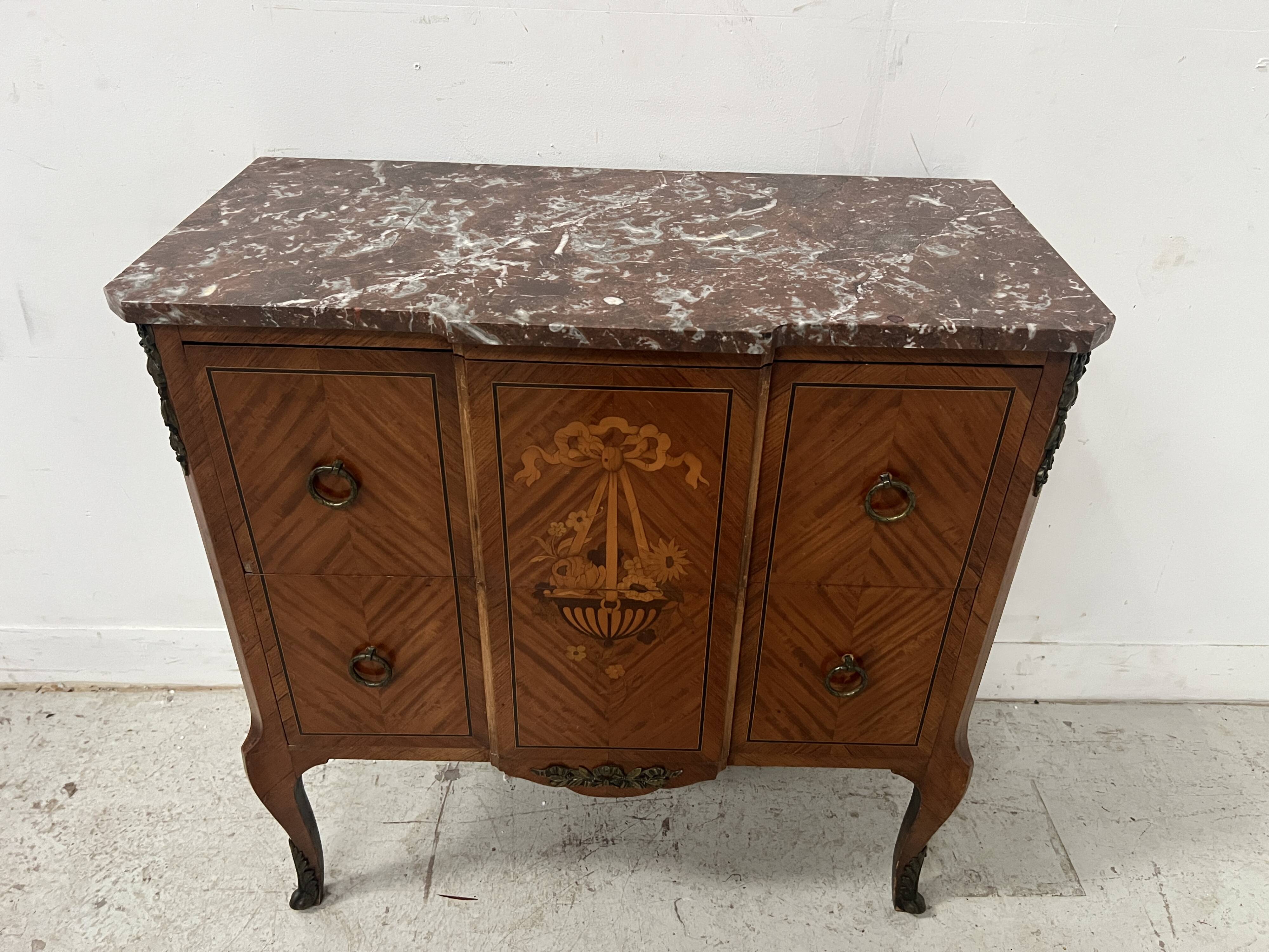 Transitional style commode with a protruding front, in marquetry wood, 20th century.