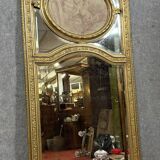 monumental Louis XVI style trumeau mirror in gilded wood