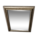 Beveled mirror under gold frame