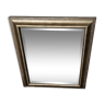 Beveled mirror under gold frame