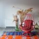Restored vintage 70s armchair with custom-made Moroccan cushions, pink and red armchair