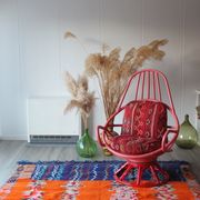 Restored vintage 70s armchair with custom-made Moroccan cushions, pink and red armchair