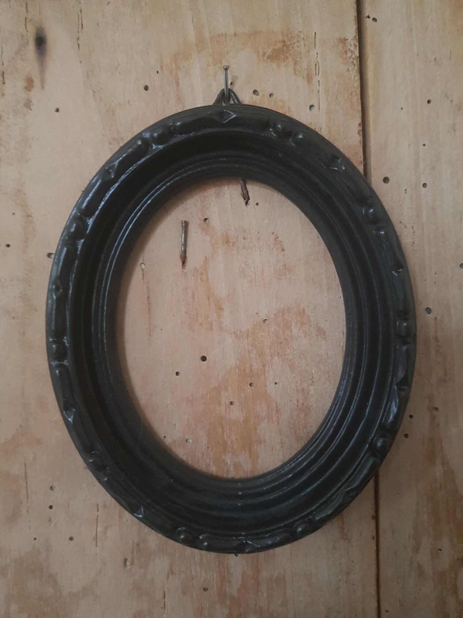Black oval frame