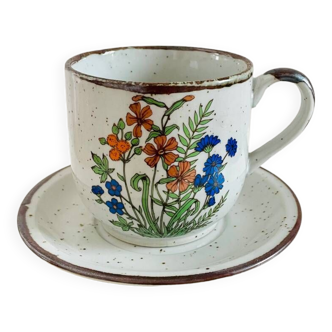 Vintage flowered stoneware cup and saucer