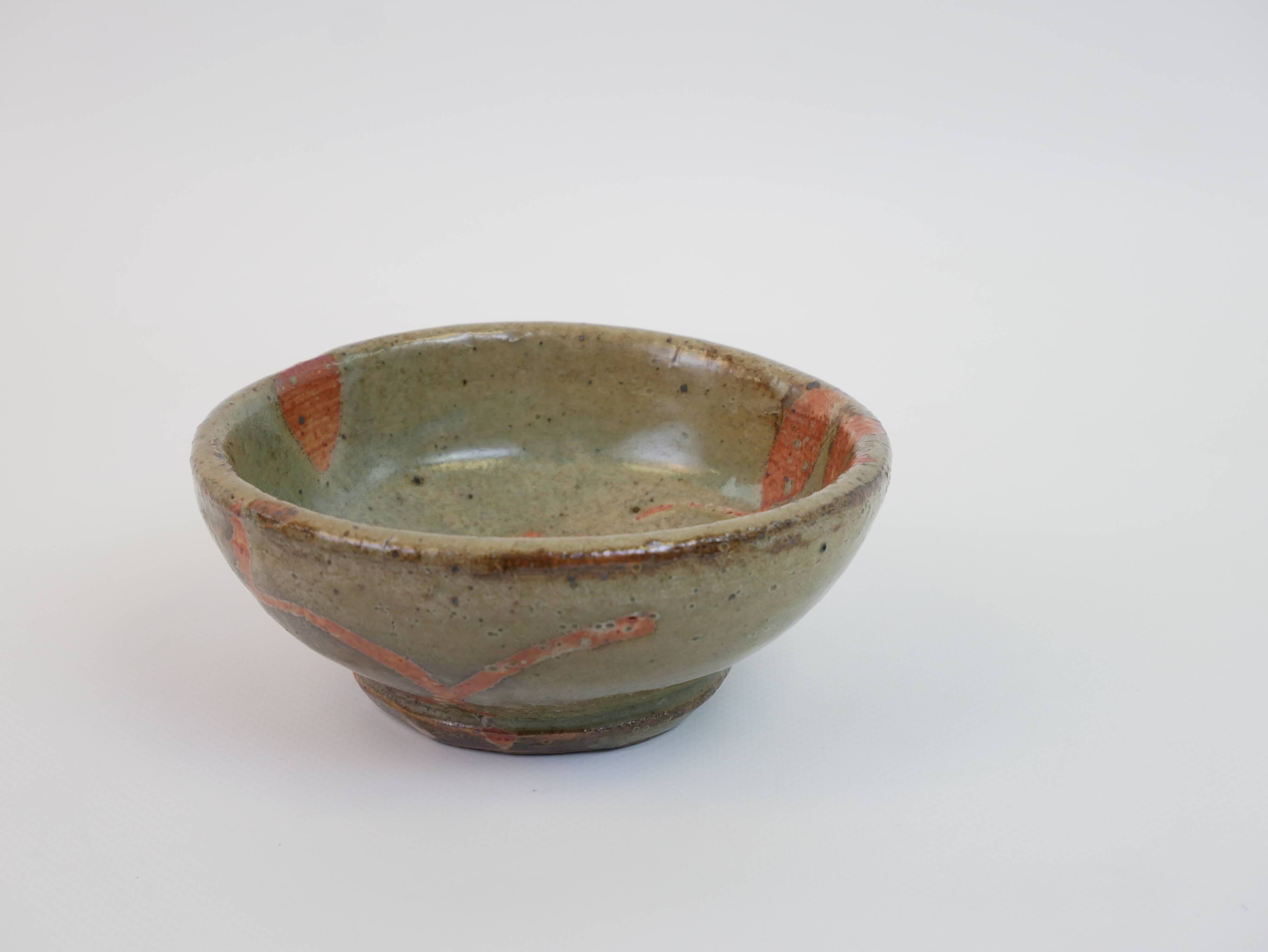 Small bowl in water green glazed ceramic with coral pink pattern