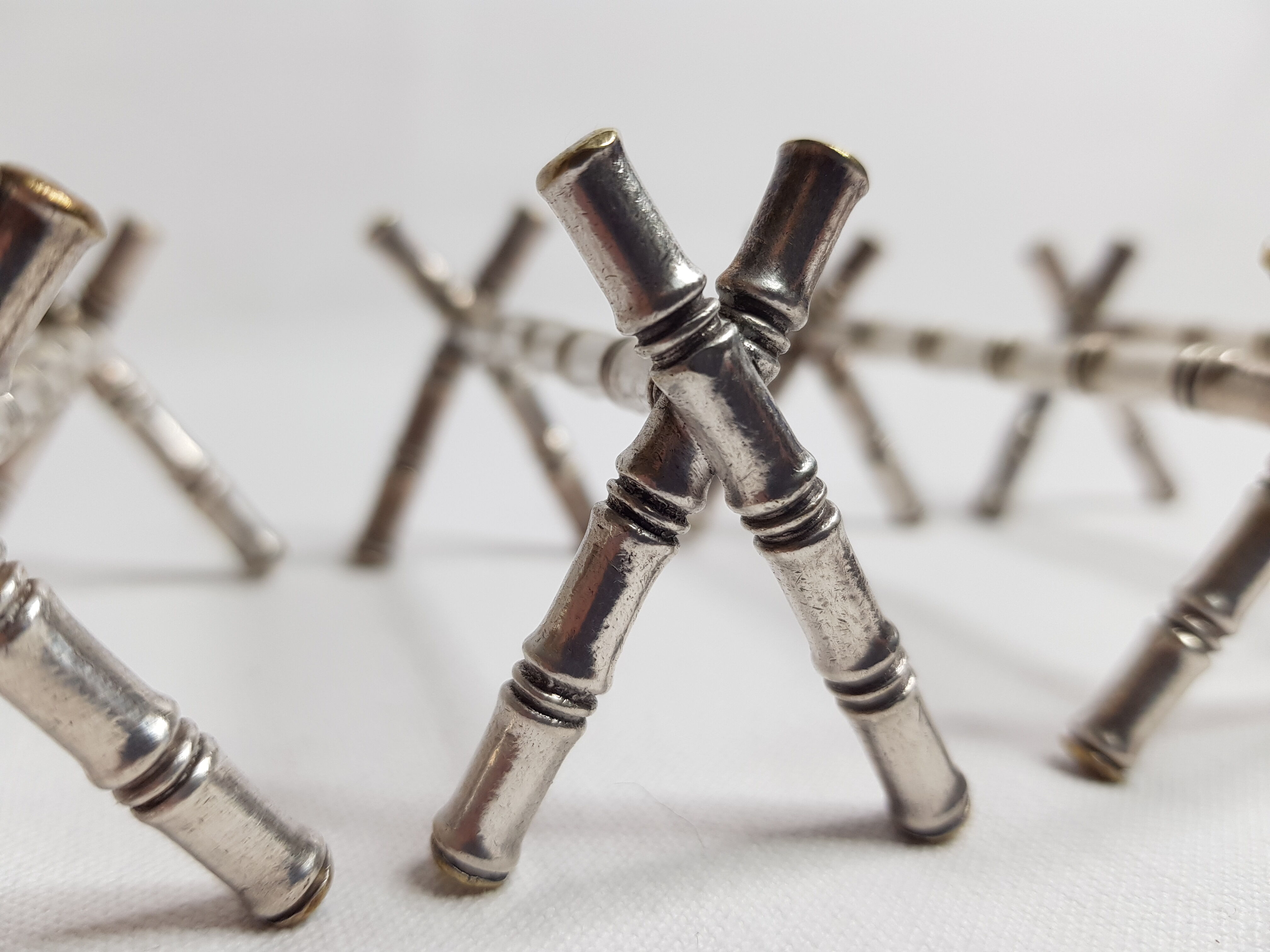 Set of six knife holders in silver metal in imitation of bamboo