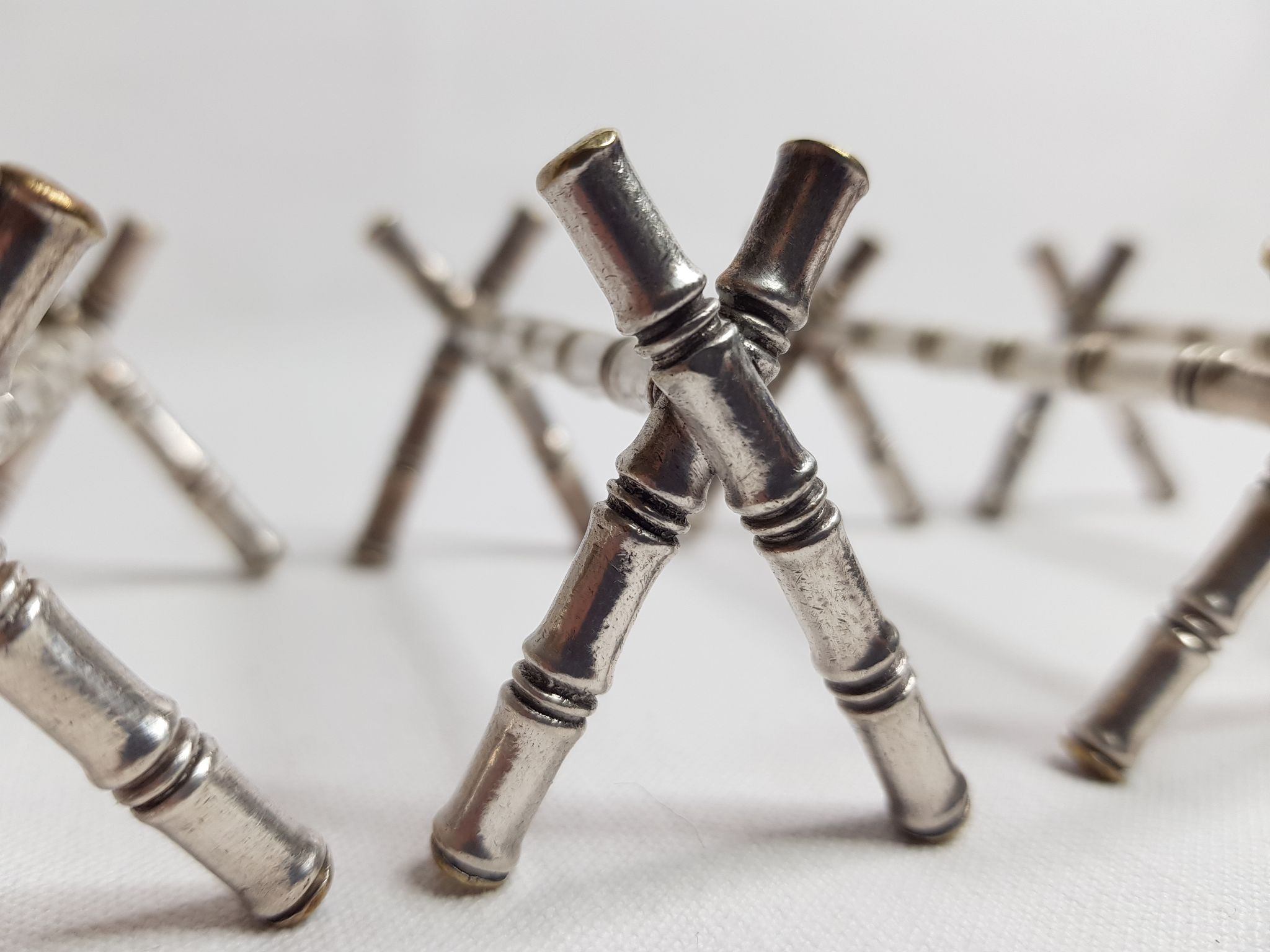 Set of six knife holders in silver metal in imitation of bamboo
