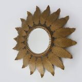 Old sun mirror with foliage in gilded metal with twisted frieze from the 60s